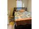 Bedroom with full bed and patterned bedding at 3128 S Holt Rd, Indianapolis, IN 46221