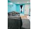 Living room with gray sectional sofa and teal walls at 3128 S Holt Rd, Indianapolis, IN 46221