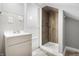 Modern bathroom with a walk-in shower and taupe vanity at 3340 N Sherman Dr, Indianapolis, IN 46218