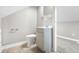 Small bathroom with toilet, vanity, and taupe cabinet at 3340 N Sherman Dr, Indianapolis, IN 46218
