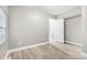 Bright bedroom with hardwood floors and access to another room at 3340 N Sherman Dr, Indianapolis, IN 46218