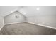 Spacious bonus room with grey carpet and sloped ceilings at 3340 N Sherman Dr, Indianapolis, IN 46218