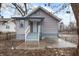 Cute bungalow with grey siding and a small front porch at 3340 N Sherman Dr, Indianapolis, IN 46218