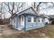 Newly renovated home with gray siding, blue accents and a landscaped yard at 3340 N Sherman Dr, Indianapolis, IN 46218