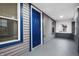 Enclosed front porch with blue door and gray siding at 3340 N Sherman Dr, Indianapolis, IN 46218
