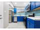 Modern kitchen with blue cabinets and stainless steel appliances at 3340 N Sherman Dr, Indianapolis, IN 46218