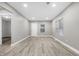 Spacious living room with light gray walls and vinyl plank flooring at 3340 N Sherman Dr, Indianapolis, IN 46218