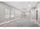 Spacious living room with light gray walls and vinyl plank flooring at 3340 N Sherman Dr, Indianapolis, IN 46218