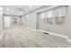 Bright living room featuring hardwood floors and large windows at 3340 N Sherman Dr, Indianapolis, IN 46218