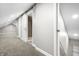 Upper floor hallway with barn door and carpet at 3340 N Sherman Dr, Indianapolis, IN 46218