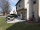 Backyard features a patio with a table and chairs, ideal for outdoor dining and enjoying the peaceful setting at 3656 Homestead E Cir, Plainfield, IN 46168