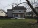 Backyard featuring a patio with lounge seating, table and chairs, fire pit, and grassy area at 3656 Homestead E Cir, Plainfield, IN 46168