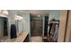 Bathroom featuring modern vanity, large mirror, and a glass-enclosed shower at 3656 Homestead E Cir, Plainfield, IN 46168