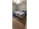 Bedroom featuring a large bed with decorative quilt and carpeted floors at 3656 Homestead E Cir, Plainfield, IN 46168