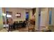Open-concept dining room with a large table and easy access to the stairs at 3656 Homestead E Cir, Plainfield, IN 46168