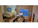 Bright dining area featuring a wood table, window views, and stylish lighting fixture at 3656 Homestead E Cir, Plainfield, IN 46168