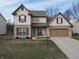 Charming two-story home featuring red shutters, a two-car garage, and a well-maintained front yard at 3656 Homestead E Cir, Plainfield, IN 46168