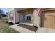 Inviting front porch with a blue door, brick accents, and a cozy bench for relaxing outdoors at 3656 Homestead E Cir, Plainfield, IN 46168
