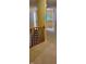 Upstairs hallway featuring a wooden banister and neutral decor with a view of the stairs at 3656 Homestead E Cir, Plainfield, IN 46168