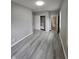 Spacious bedroom with wood-look floors and ample closet space at 4041 Boulevard Pl, Indianapolis, IN 46208