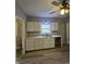 Kitchen with white cabinets, new appliances, and vinyl flooring at 4041 Boulevard Pl, Indianapolis, IN 46208