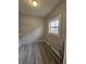 Laundry area with window, shelving, and vinyl flooring at 4041 Boulevard Pl, Indianapolis, IN 46208