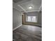 Living room with hardwood floors, bay window and decorative ceiling beams at 4041 Boulevard Pl, Indianapolis, IN 46208