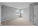 Bright bedroom featuring plush carpeting and natural light from two windows at 4171 Douro Trl, Westfield, IN 46062