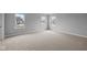 Spacious carpeted bedroom with large windows offering plenty of natural light and neutral walls that can blend with any decor at 4171 Douro Trl, Westfield, IN 46062