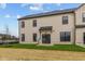 Beige sided home with black trim, a covered patio, and a well manicured, newly seeded lawn at 4171 Douro Trl, Westfield, IN 46062