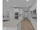 Modern kitchen boasts white cabinets, quartz countertops and stainless steel appliances at 4171 Douro Trl, Westfield, IN 46062