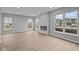 Bright living room with ample windows, a fireplace, and light wood flooring, creating a cozy and inviting atmosphere at 4171 Douro Trl, Westfield, IN 46062