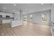 Open-concept living space features wood floors and plenty of natural light at 4171 Douro Trl, Westfield, IN 46062