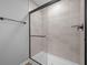 Modern glass-enclosed shower with sleek hardware and neutral tile, offering a luxurious and spa-like experience at 4171 Douro Trl, Westfield, IN 46062