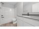 Bathroom featuring a single sink vanity with white cabinets, gray countertop, and modern faucet at 4195 Douro Trl, Westfield, IN 46062