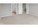 Light-filled bedroom with neutral carpet, showing access to an ensuite bathroom and closet at 4195 Douro Trl, Westfield, IN 46062