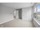 Bedroom featuring plush carpet, ample closet space, and natural light from a window at 4195 Douro Trl, Westfield, IN 46062