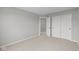 Bedroom featuring neutral paint color, carpet flooring, a closet, and an open doorway to another room at 4195 Douro Trl, Westfield, IN 46062