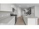 Bright, white kitchen featuring quartz countertops, stainless appliances, and durable flooring at 4195 Douro Trl, Westfield, IN 46062
