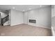 Modern living room with a sleek fireplace and durable floors at 4195 Douro Trl, Westfield, IN 46062