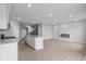 Open-concept living space with a fireplace, durable floors, and ample natural light at 4195 Douro Trl, Westfield, IN 46062