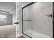 Contemporary glass-enclosed shower showcasing modern tile and sleek black hardware at 4195 Douro Trl, Westfield, IN 46062