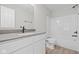 Modern bathroom with white cabinets, a stone countertop, and a shower/tub combo at 4205 Douro Trl, Westfield, IN 46062