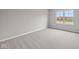 Bright bedroom with a large window and neutral carpeting at 4205 Douro Trl, Westfield, IN 46062