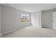 Neutral bedroom with soft carpeting and large, bright window at 4205 Douro Trl, Westfield, IN 46062