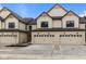 Charming townhome featuring a well-manicured lawn and a two-car garage for convenient parking and storage at 4205 Douro Trl, Westfield, IN 46062
