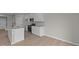 Clean kitchen featuring white cabinets, stainless appliances, and hardwood floors at 4205 Douro Trl, Westfield, IN 46062