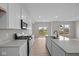 Bright kitchen featuring white cabinets, modern stainless appliances and a large island at 4205 Douro Trl, Westfield, IN 46062