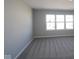 Spacious bedroom with a large window offering plenty of natural light and plush carpet flooring at 4229 Douro Trl, Westfield, IN 46062