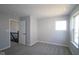 Neutral bedroom features a large window, plush carpeting, and closet at 4229 Douro Trl, Westfield, IN 46062